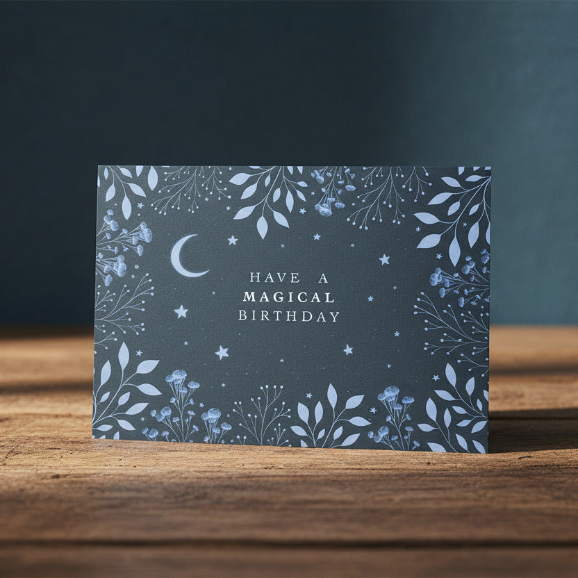 Greeting card with blue floral design and 'Have a Magical Birthday' text on a dark background