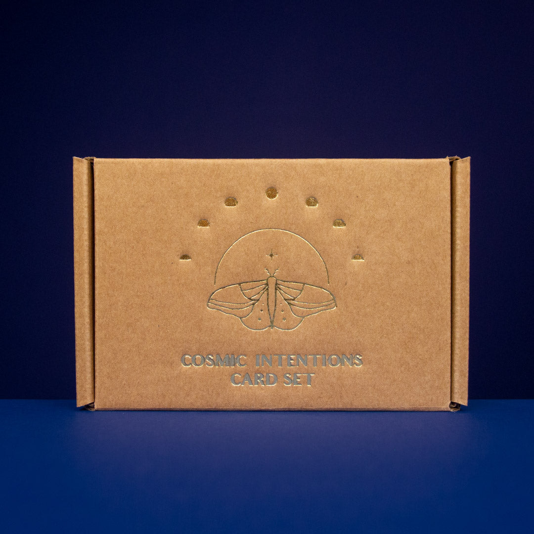 Cosmic Intentions Oracle Card Set - Gold Edition by Anna Cosma on a blue background