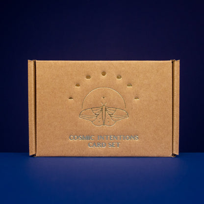 Cosmic Intentions Oracle Card Set - Gold Edition by Anna Cosma on a blue background