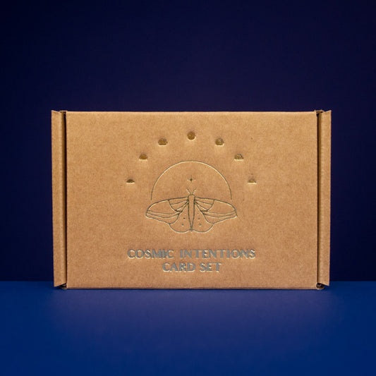Cosmic Intentions Oracle Card Set - Gold Edition by Anna Cosma on a blue background
