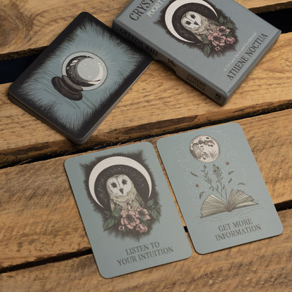 Set of tarot cards with moon and owl designs on a wooden surface