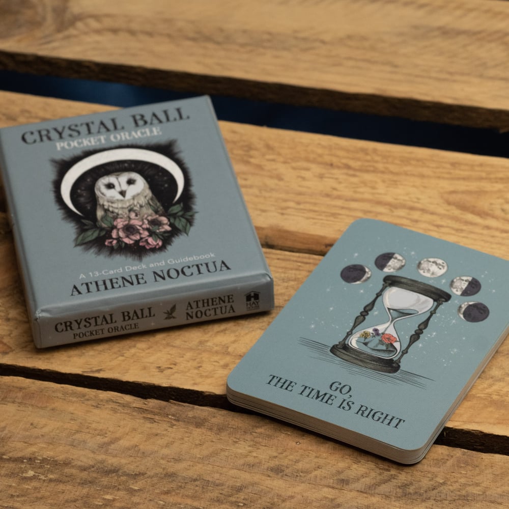 Crystal Ball Pocket Oracle cards by Athene Noctua on a wooden surface