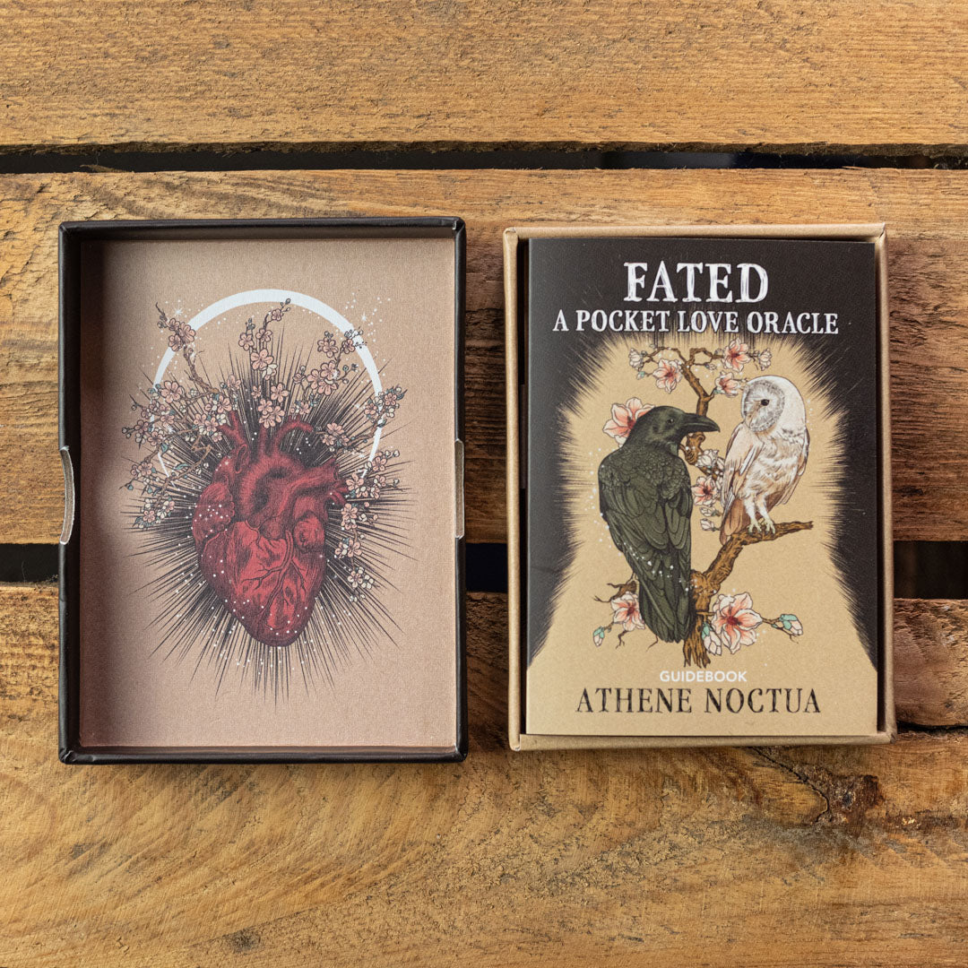 Oracle card set with 'Fated: A Pocket Love Oracle' and 'Athene Noctua' on a wooden surface.