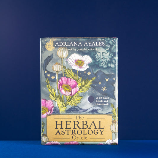 Book titled 'The Herbal Astrology Oracle' by Adriana Ayales on a blue background