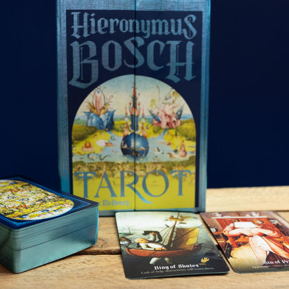 Hieronymus Bosch Tarot set with cards and box on a wooden surface