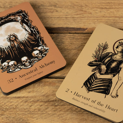 Two tarot cards from Lost Oracle Card Deck on a wooden surface, featuring intricate designs and text.