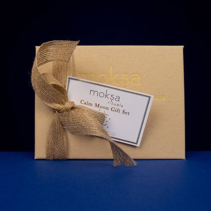 Gift set with 'moksa' branding on a dark background
