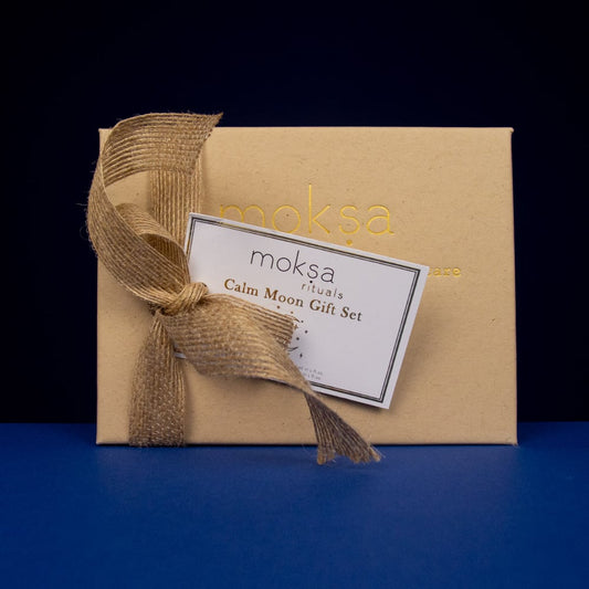 Gift set with 'moksa' branding on a dark background