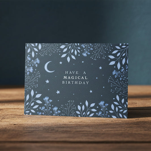 Greeting card with blue floral design and 'Have a Magical Birthday' text on a dark background