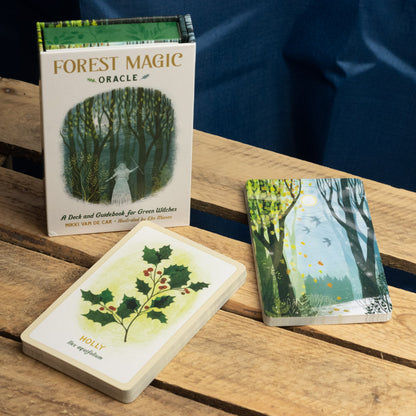 FOREST MAGIC Oracle deck on a wooden surface with a blue fabric background