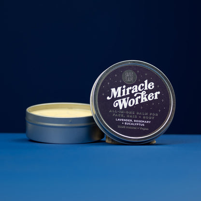 Tin of 'Miracle Worker' balm with a blue background